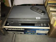 A vintage boxed Panasonic video cassette recorder NV-HV60 EB-S plus a JVC VCR