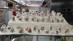 Fifty pieces of assorted crested china, various crests,