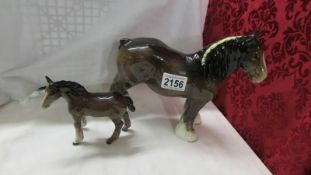 A Beswick shire horse and a Beswick foal.