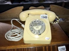 A vintage cream dial telephone