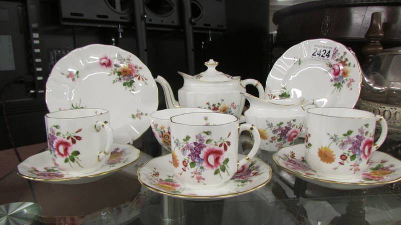 A Royal Crown Derby posies teapot, sugar bowl, milk jug, two tea plates,