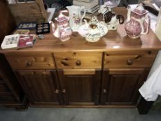 A solid pine 3 drawer 3 door kitchen cupboard dresser base