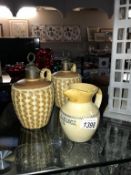 A pair of Scott & Sons of Southwick basket stoneware spirit decanters and a stoneware jug impressed
