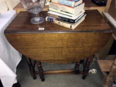 An oak gateleg table