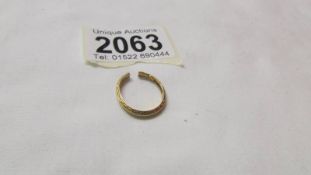 An 18ct gold ring, a/f (split), 2.1 grams.