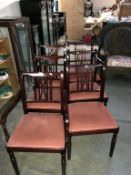 A set of 6 mahogany dining chairs with pink fabric seats
