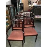 A set of 6 mahogany dining chairs with pink fabric seats