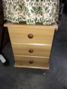 A pine effect bedroom chest of drawers