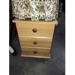 A pine effect bedroom chest of drawers