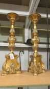A pair of tall gilded 'pricket' candlesticks.