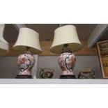 A pair of Imari style table lamps with silk shades,