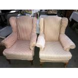 A pair of pink and cream stripped arm chairs