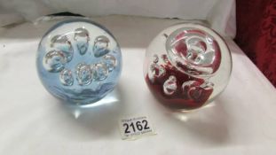 Two good quality glass paperweights.