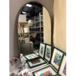 A vintage arch style bevel edged wall mirror