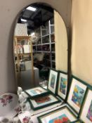 A vintage arch style bevel edged wall mirror