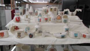 Thirty five pieces of W H Goss crested china.