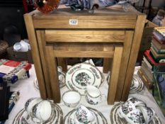 A modern solid oak nest of tables