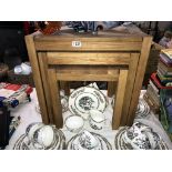 A modern solid oak nest of tables