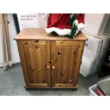 A pine computer desk/cupboard