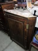 A Victorian oak corner cupboard