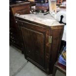 A Victorian oak corner cupboard