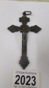 A metal crucifix pendant.
