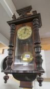 A Victorian mahogany wall clock.