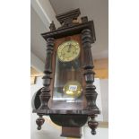 A Victorian mahogany wall clock.