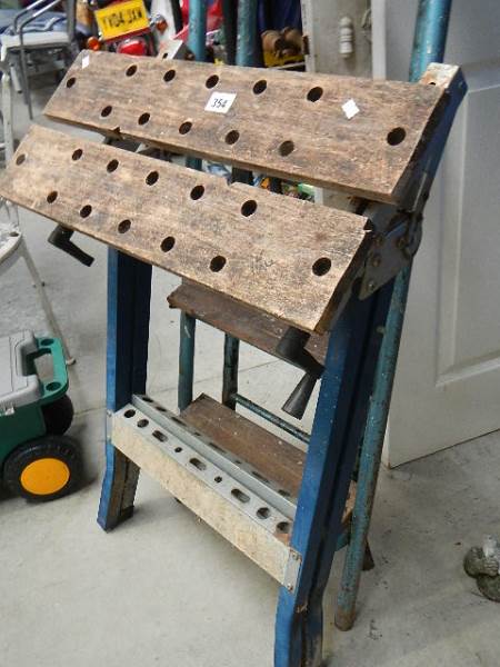 A folding work bench and a 5 tread step ladder. - Image 2 of 3