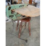 A Rexon scroll saw, works but needs attention and an old 4 leg stool.