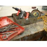 A Hilti TE17 and a Black and Decker 9" grinder, both 110V and a box of masonry drill bits.