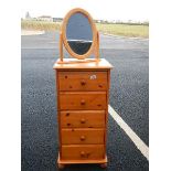 A pine 5 drawer chest and a pine mirror.