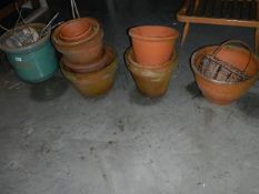 Approximately 14 assorted terracotta pots.