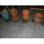 Approximately 14 assorted terracotta pots.