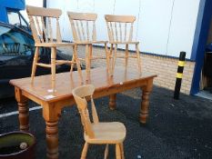 A pine dining table and 4 chairs (table 83 x 91 cm x 78 cm high).