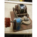 A vintage belt driven buffing machine, in working order.