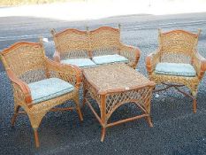 A cane conservatory suite in good condition.