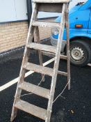 A old wooden 6 tread step ladder.