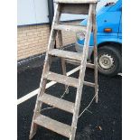 A old wooden 6 tread step ladder.