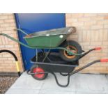 2 wheel barrows, one as new and one in good condition,.
