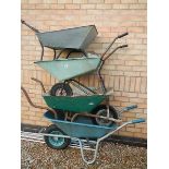 4 wheelbarrows in various conditions.