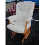 A modern rocking chair with locking arm and a Queen Anne style stool.