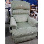 A green electric recliner chair.