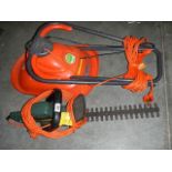 A Black & Decker hedge trimmer and a Flymo micro lite hover mower.