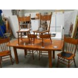 A good quality solid oak extending dining table with 6 chairs,.
