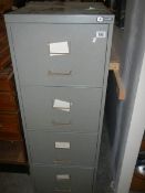 A grey metal filing cabinet.