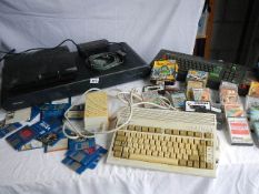 A Commodore Amiga A600 with power supply, an Amstrad CPC 464 with games/discs,