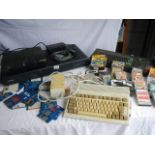 A Commodore Amiga A600 with power supply, an Amstrad CPC 464 with games/discs,