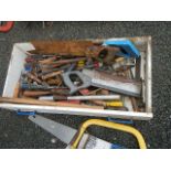 A quantity of old saws, chisels etc.