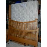 A solid oak bed frame with Myers mattress in good clean condition,